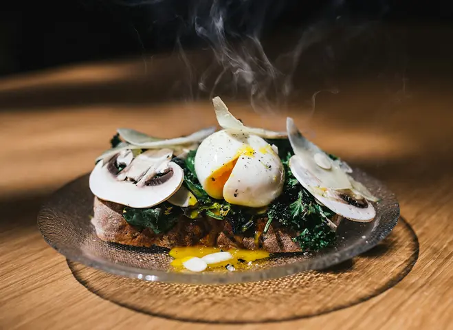 A beautifully prepared dish featuring foraged mushrooms as the main ingredient.